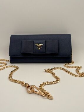 Prada Navy Saffiano Leather Bow wallet with Gold Chain Strap. Comes with box